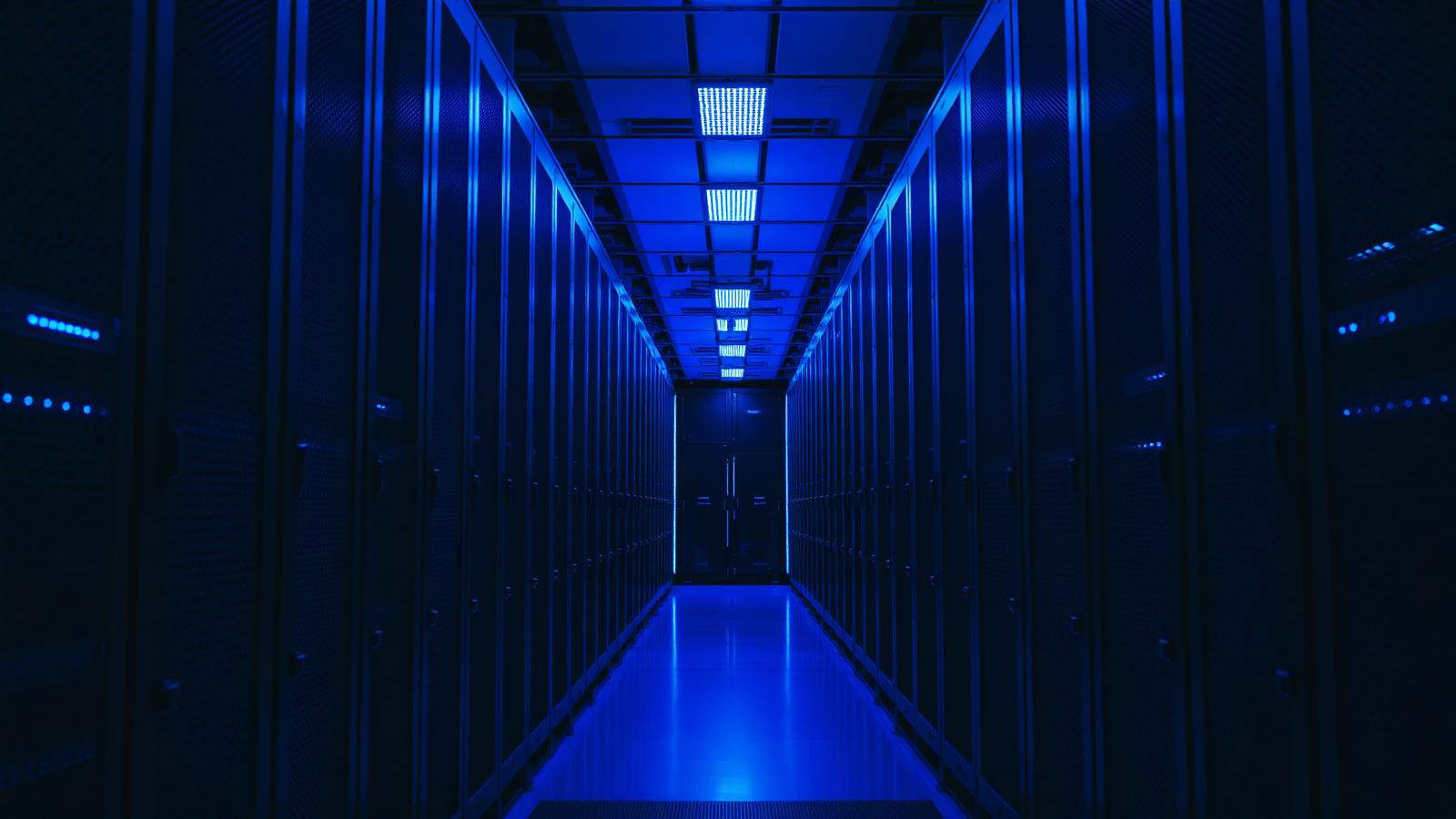 A high-end server rack illuminated by blue light in a modern data center representing local AI infrastructure.